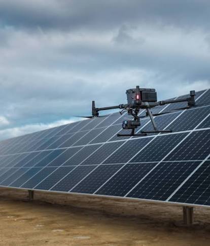 Inspection drone flying above solar panels
